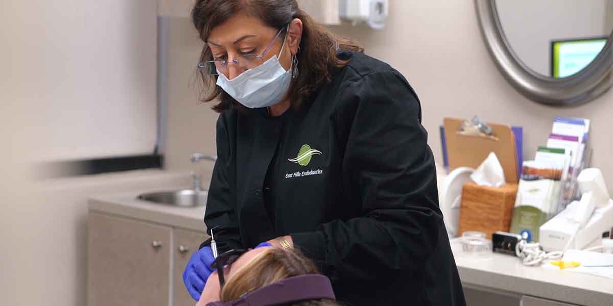 Woman flossing her teeth